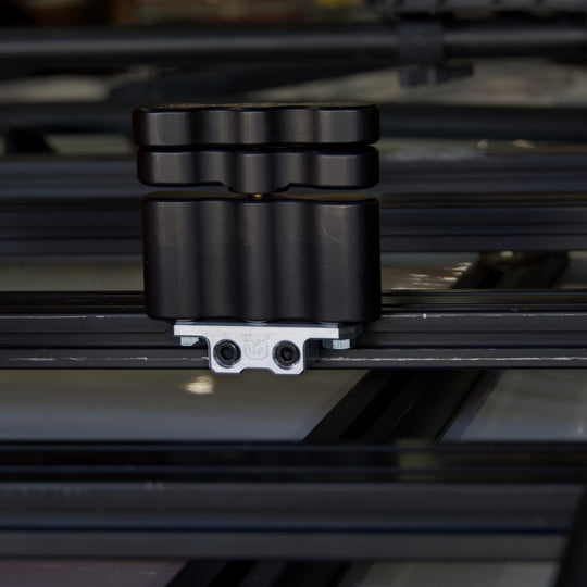 Billet aluminum Rotopax mount adapter for extrusion roof rack cross bars. - Premium Truck Accessory by Xtreme Canopies
