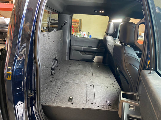 Ford Super Duty Ford - F250-F550 - 2023-Present - 5th Gen. Crew Cab - Second Row Seat Delete Plate System with Factory B&O Subwoofer Center Wall with Exterior Port - Premium Seat Delete Plate System by Xtreme Canopies