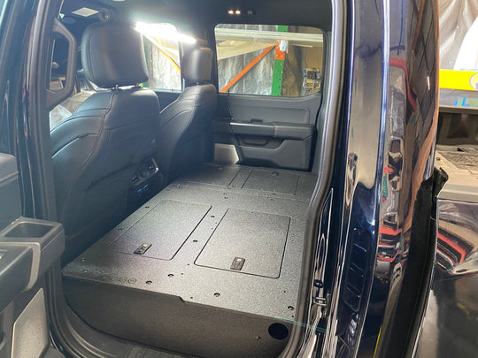 Ford Super Duty Ford - F250-F550 - 2023-Present - 5th Gen. Crew Cab - Second Row Seat Delete Plate System with Factory B&O Subwoofer Center Wall with Exterior Port - Premium Seat Delete Plate System by Xtreme Canopies