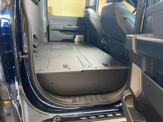 Ford Super Duty Ford - F250-F550 - 2023-Present - 5th Gen. Crew Cab - Second Row Seat Delete Plate System with Factory B&O Subwoofer Center Wall with Exterior Port - Premium Seat Delete Plate System by Xtreme Canopies